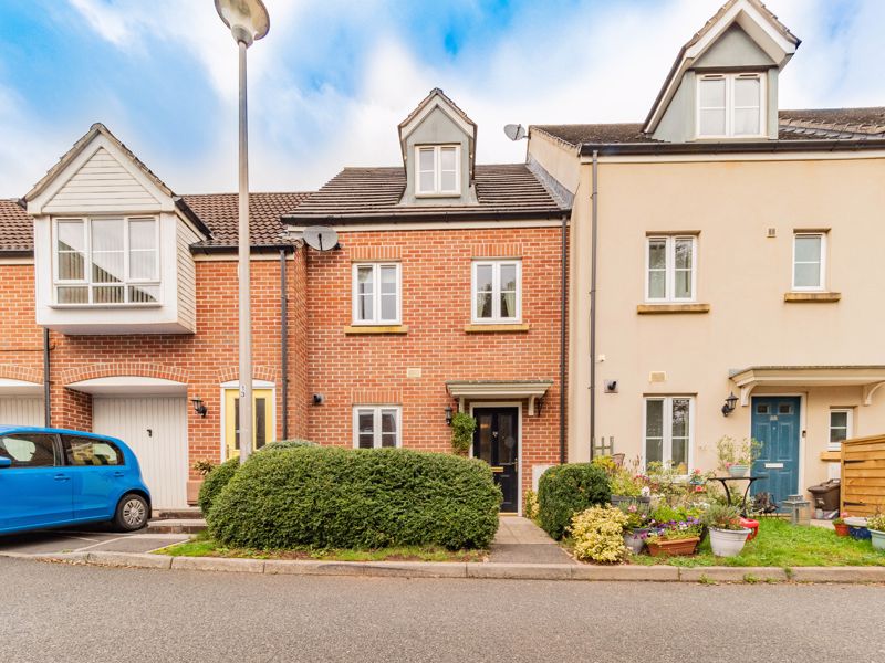 A well-presented, modern three-bedroom townhouse located on this popular development, enjoying a level enclosed garden and SINGLE GARAGE.