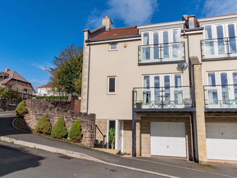 Enjoying an elevated position with southerly views on this select development, this end-terrace, three-bedroom townhouse offers spacious accommodation, a garage and off-street parking.