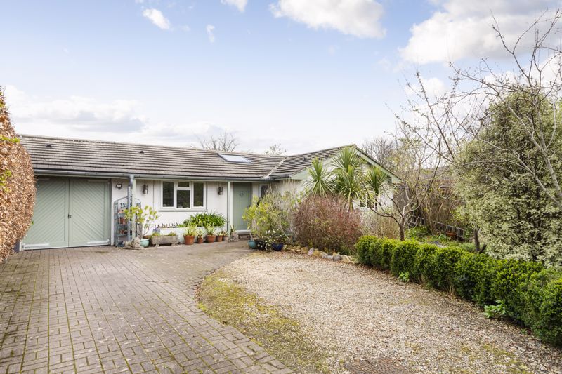 Spacious four bedroom detached bungalow which is beautifully presented throughout with stunning open plan living, landscaped gardens, open views, off street parking and garage. 