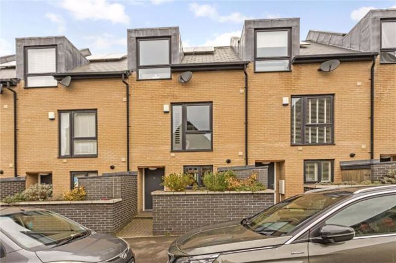 *** NO ONWARD CHAIN *** A modern three-storey, four double bedroom townhouse with allocated parking, occupying a favourable location just off North Street.