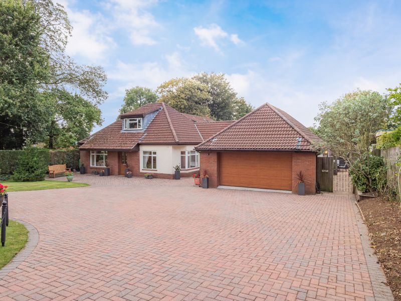 A spacious and well proportioned four bedroom family home situated in a large plot with double garage and off street parking. 