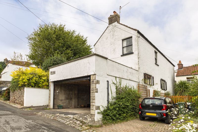 NO ONWARD CHAIN - Three bedroom detached cottage full of charm located in a tucked away location with stunning southerly views. 