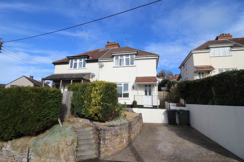 Located in an elevated position, this three-bedroom semi-detached property enjoys a lovely private garden with superb views