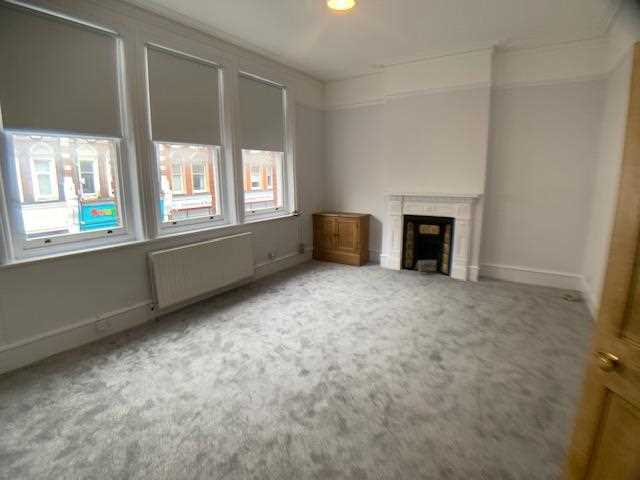 AVAILABLE IMMEDIATELY! Located above commercial premises is this spacious, newly decorated and carpeted UNFURNISHED split level flat. the accommodation comprises of two double bedrooms, equipped kitchen, a large reception featuring an ornate fireplace and bathroom with three piece suite. ...