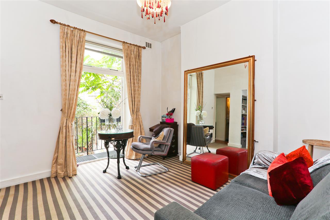 CHAIN FREE! A well presented and spacious (approximately 525 Sq Ft / 49 Sq M) raised ground floor apartment forming part of a converted linked end of terrace Victorian house situated in a popular and sought after residential location within close proximity to Chalk Farm, Camden and Belsize ...