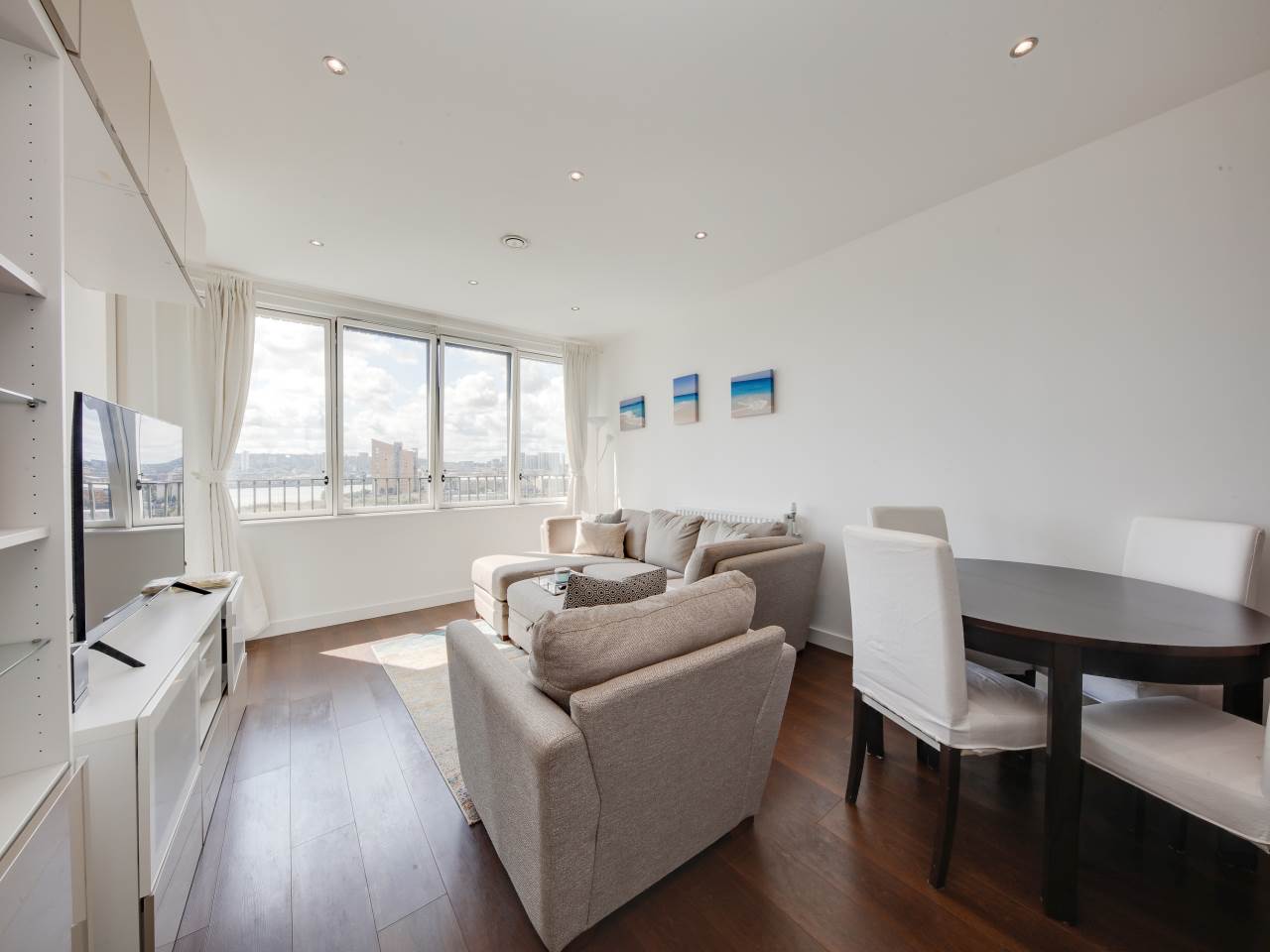 Lifestyle Property present this high specification one bedroom apartment, located in the Rendel Apartments, part of the new Royal Albert Wharf development, just moments from Gallions Reach DLR Station.A simply stunning, luxurious property with a high end finish, set next to the water offering marina and river views. The open plan lounge / kitchen is a great space, with wood flooring. There's four vertical windows facing the marina & River Thames for tranquil views and lots of natural light. Access to the fully decked balcony and winter garden via the full length glazed patio door. The fully fitted kitchen is simply beautiful, featuring soft-closing wall & base units and glazed charcoal splash back.Moving on to the bathroom, which features tiled walls and floor, large bathtub with Grohe thermostatically controlled mixer taps, shower attachment and clear glass shower screen. Vanity unit with storage and full width mirror above and a ladder style heated towel rail in a chrome finish.The bedroom is an excellent size with a cream carpet, built-in wardrobe with glazed/mirrored sliding doors. Access to the winter garden / balcony via two full length glazed patio doors.117 years remaining on lease
Annual Service charge: £2000.00
Annual ground rent: £300.00