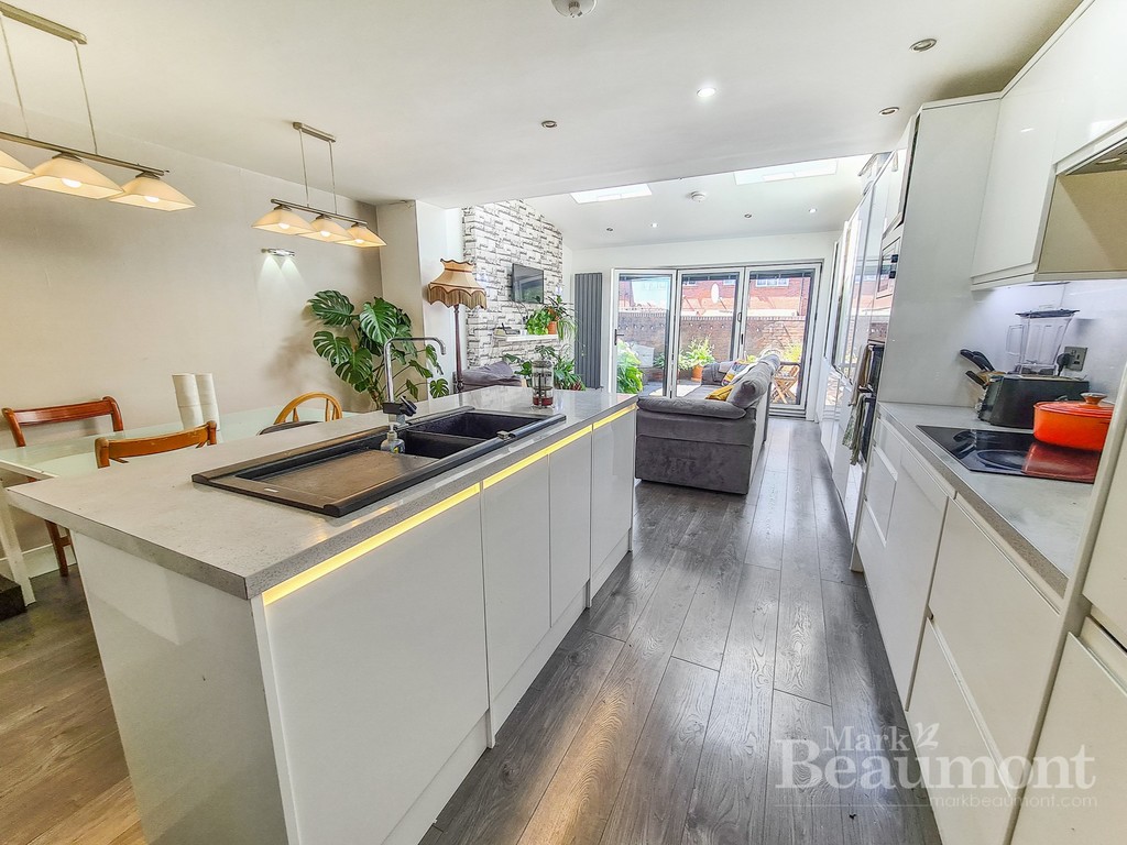 For sale. Three/Four bedroom, two bathrooms.  Extended end of terrace family home situated on a quiet street anda town garden. Near Peckham Rye and Queens Road station. 1158 sq ft.