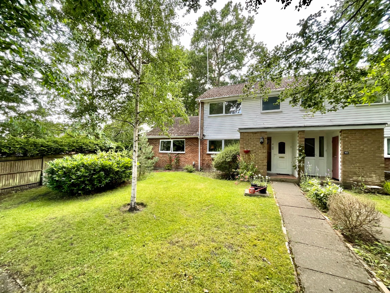 Available with no onward chain tucked away on a peaceful woodland walkway within Heatherside, is this flexible & versatile three/four bedroom family home on a large corner plot with a garage in a nearby block...