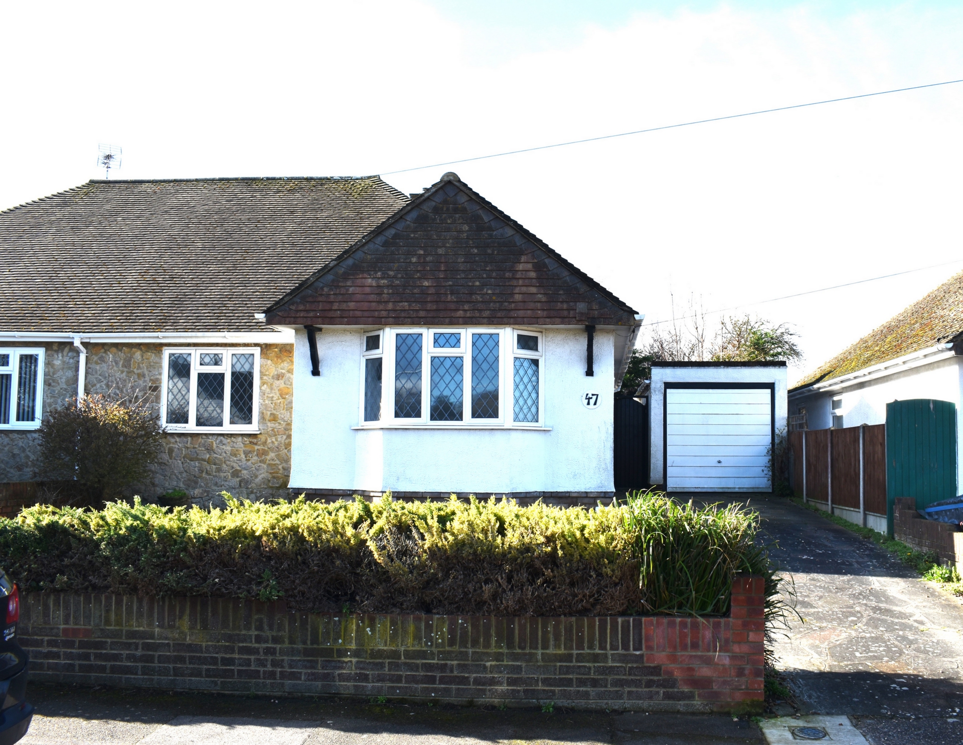 Elevated, spacious 2 double bedroom semi-detached bungalow boasting a garage and driveway in a highly desirable location.