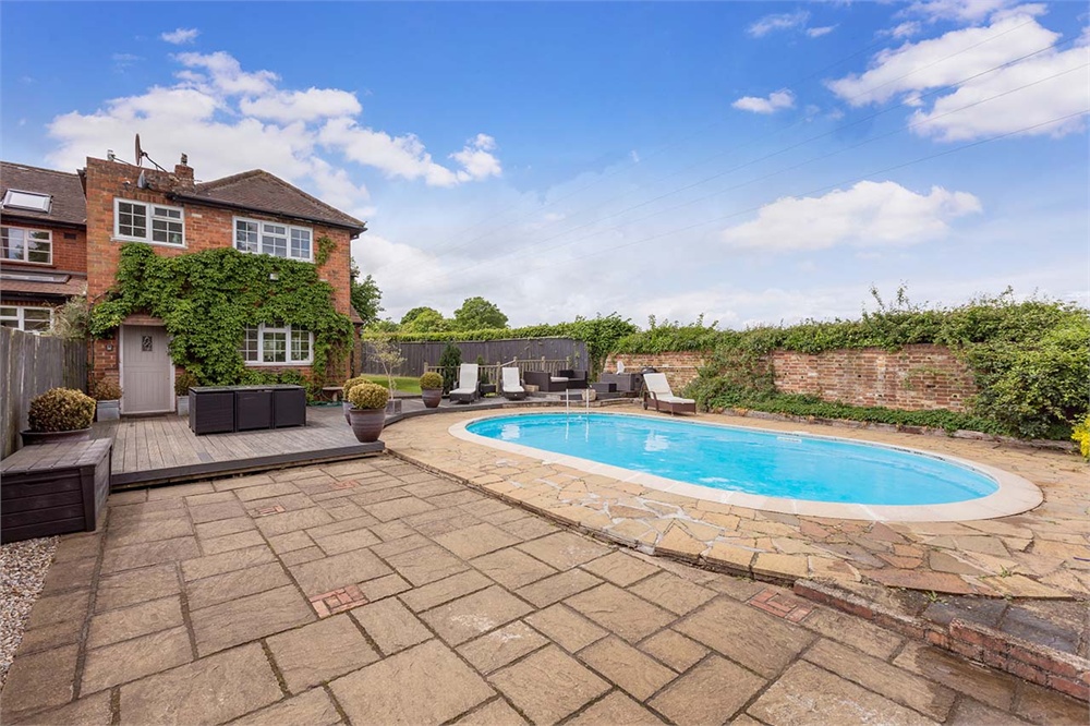 ** VIDEO TOUR AVAILABLE ** Four bedroom semi-detached CHARACTER HOME offering stunning views of COUNTRYSIDE and with PREVIOUS PLANNING PERMISSION for studio/gym, 36ft kitchen/living area, 2 bathrooms, garden with HEATED SWIMMING POOL, 21ft double garage, NO CHAIN.