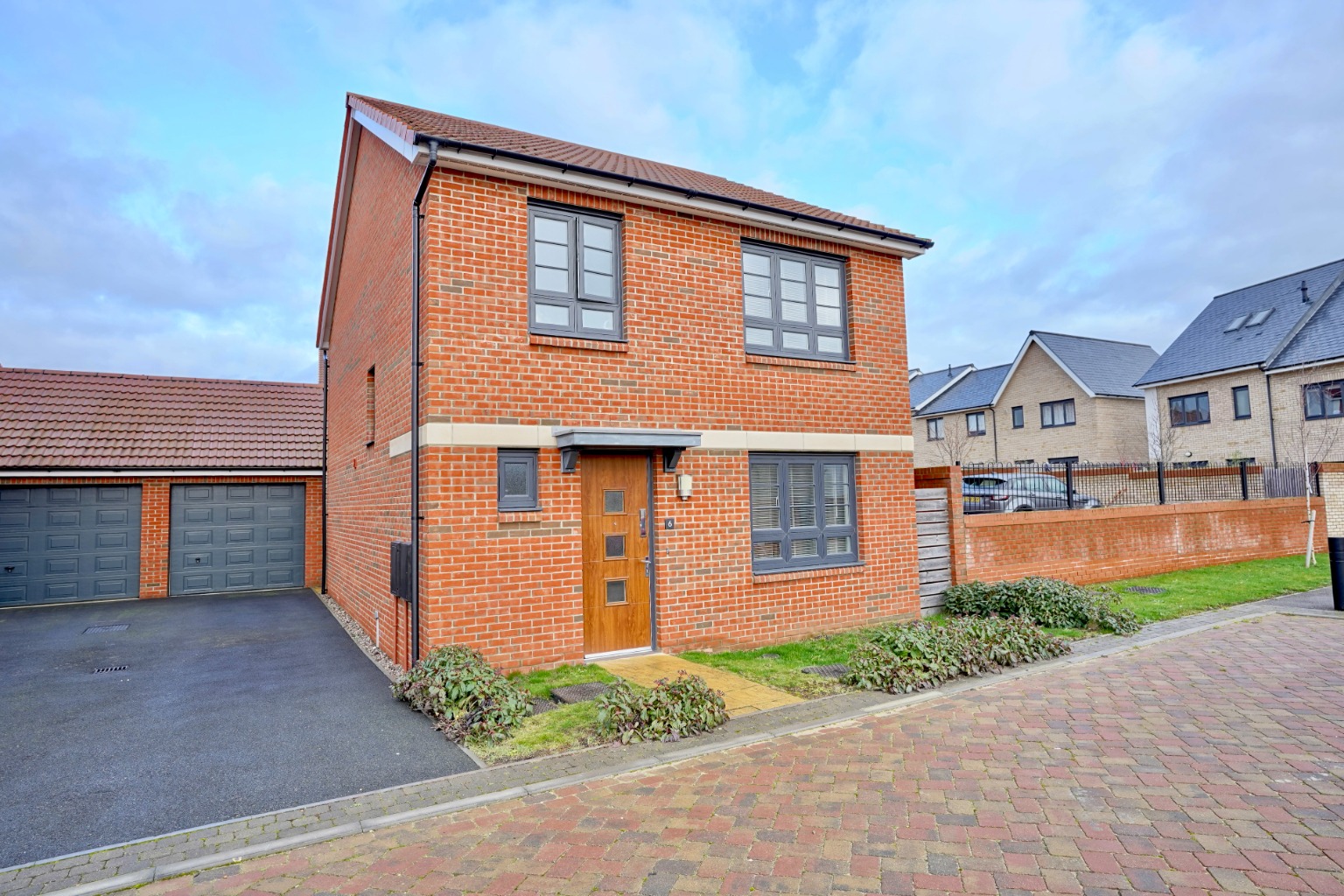 The interior comprises an entrance hall, a ground floor cloakroom, and a beautiful open-plan interior. There's a modern fitted kitchen with an island and dining area, being open plan to the lounge with French doors out to the garden - making the space very bright and airy.  Upstairs, you will find..