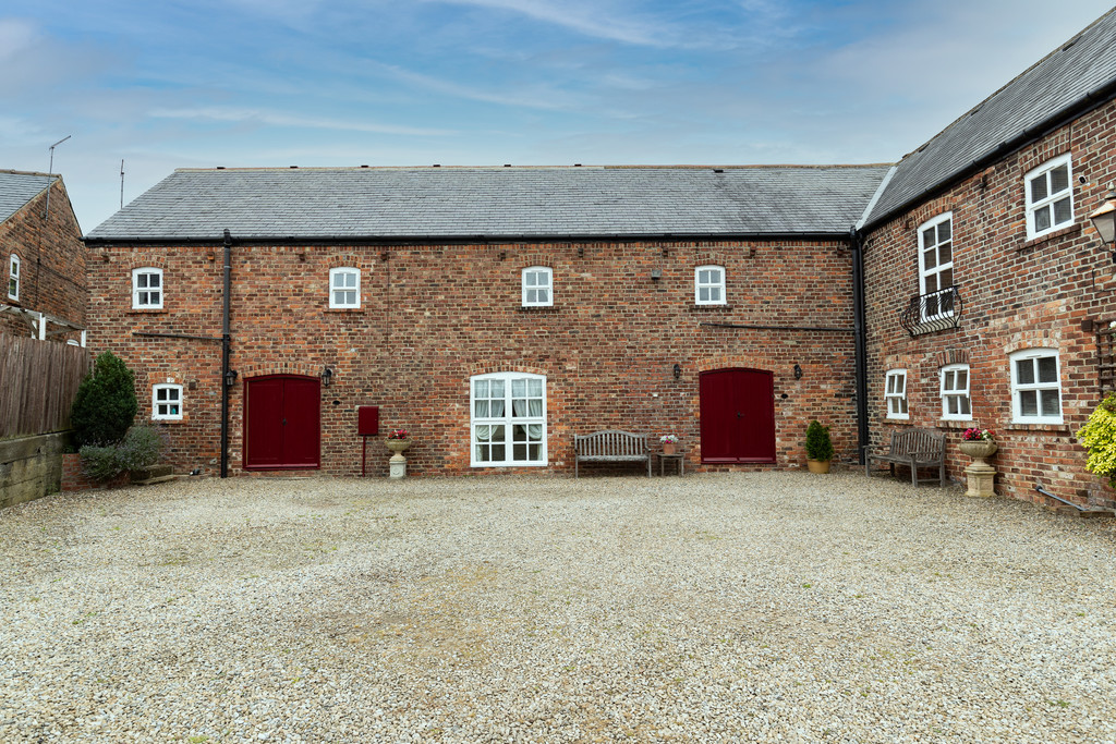 This fabulous barn conversion is one of two properties previously used as one whole and split into two. The property offers a private courtyard with a double garage, gated access to both sides and private rear gardens. A detached stable block with 4 indoor boxes, approximately 2-acre paddock along with an orchard plus lawned gardens with stunning far reaching open views completes this estate all set at the end of a private driveway.