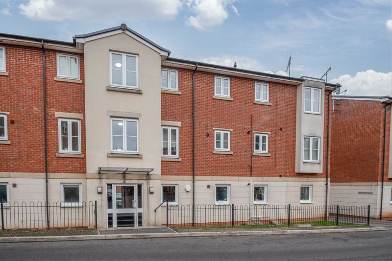 A modern, welcoming two bedroom top floor apartment, close to the town centre with allocated parking. <br/><br/>The property is approached to the immediate left as you drive into the parking area and is accessed through a secure entrance with stairs to a landing, the layout briefly comprises: Hallway with window to side and useful storage cupboard.  Spacious dual aspect living room with Juliet style balcony doors over looking the development, display window shelf to dining area and an opening to a pleasant fitted Kitchen having a built-in oven, electric hob, extractor hood, plumbing for an appliance and space for an upright fridge/freezer. The main bedroom one is of good proportion and benefits from a fitted wardrobe. The second double bedroom, also offers a fitted wardrobe to the alcove. The tiled bathroom, provides a shower over the bath, white fittings and window to side.<br/><br/>There are pleasant communal gardens (with a children's play area) aside the block. The parking space is situated within the large courtyard. Further benefits include double glazing and gas-fired central heating System.<br/><br/>The development was constructed in around 2011, and is well placed for the town centre amenities, including the bus and railway stations, Kingfisher shopping centre, a main supermarket and retail park, excellent restaurants and eating establishments, as well as the multi-screen cinema. 