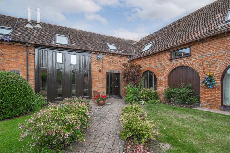 <br/><br/><p ><span > </span></p><p ><span > </span></p><p ><span >A characterful three-bedroom barn conversion, boasting an impressive master bedroom with dressing room and en-suite bathroom, generous living space, a double garage and a private courtyard garden, well situated in the charming grounds of the Coach Farm Barns development in Hunt End, Redditch.<br/><br/></span></p><p ><span >The ground floor accommodation comprises: Spacious hallway with an original stone flooring and stairs to the first-floor landing, the double doors to the left lead you into the large sitting room with a feature log burner and floor-to-ceiling windows. To the right of the hallway is the fitted kitchen with a centred island, period beams and access to the private garden, then into the dining room with a feature arched window with a view of the front courtyard. The ground floor accommodation further benefits from a handy guest WC/cloakroom. </span></p><p ><span > </span></p><p ><span >The first-floor landing establishes: Master bedroom with a dressing room and en-suite bathroom providing an elegant roll top bath, separate corner shower, sink and WC, two further double bedrooms with feature skylight windows and space for wardrobes, and the family bathroom. <br/><br/>Outside, to the rear the barn has a private courtyard garden with a decked entertaining area and backed onto open countryside fields. The property further benefits from allocated car parking and a double garage. </span></p><p ><span > </span></p><p ><span >Well placed in Hunt End, the property is 4 miles from Redditch Town Centre and all of its amenities including shops, supermarkets, restaurants, and cinema, along with the local bus and railway stations, as well as being a few miles away from the villages of Feckenham and Hanbury. The M42 and M5 motorways are easily accessible providing great commuter links. </span></p>