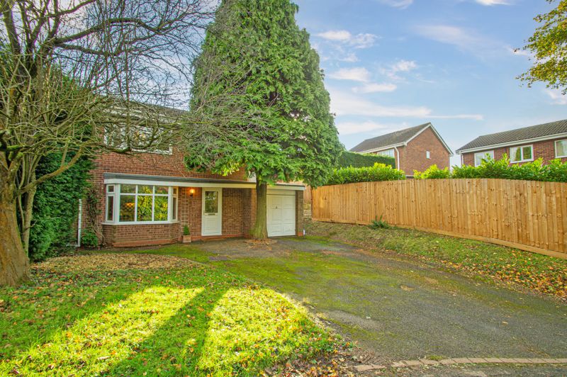 A rather spacious, three bedroom, split level detached home, placed in a popular residential location in Headless Cross, set back in a private shared driveway behind hedging.  <br/><br/>The layout is as follows: Canopied entrance with attached garage to right hand side. Entrance hallway, offering a cloaks cupboard and access to a generous ground floor w.c. /utility facility. Excellent kitchen/diner over 19ft in length, having bay window to front and window to side, ample work surfacing with units beneath and wall/display cupboards above, inset sink, gas hob, built-in oven, and superb dining area, which could also accommodate a sofa. <br/><br/>Stairs rise to the upper level, where a pleasant lounge has a feature gas fire to surround, and double French doors opening out onto the patio. There are two double bedrooms and a spacious single bedroom on this floor, as well as a quite stunning family bathroom, altered to fit both a separate shower enclosure and bath, wide modern sink with storage beneath, a w.c. and access doors to both the landing and into bedroom one. <br/><br/>Outside: The driveway can accommodate several cars, there is some storage space aside the garage, a set of steps on the left lead up to a gate into the rear garden. This has a large patio and an elevated timber seating platform gaining advantage of views over the property. There is a timber shed, a large willow tree, and gated compost area at the  far end of the garden.  <br/><br/>Other benefits include: Double glazing and modern condensing boiler with water tank in the airing cupboard.  FREEHOLD ON COMPLETION <br/><br/>Please note: Neighbouring properties have opened up the void space to the rear of the ground floor, which subject to planning, could considerably enlarge the property. (see floor plan of an indication).  <br/><br/>Locally the property is close to shops in both Headless Cross and Webheath, as well as excellent schooling, superb road transport links, a golf club and Morton Stanley Park. <br/><br/>
