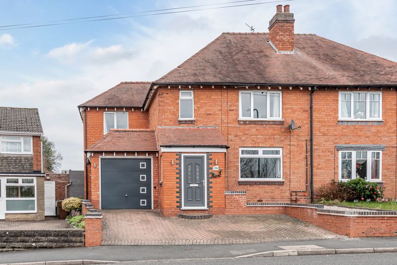 <br/><br/><p><span >A particularly well-presented and extended, four-bedroom, semi-detached family home, situated in a popular location of Catshill, Bromsgrove.</span></p><p ><span >The property interior layout briefly comprises: Enclosed brick-built porch; entrance hall extending the full length of the property, with double patio doors opening to the rear; stylish lounge with feature coal effect gas fire; stylish fitted kitchen enjoying range style cooker integrated full height fridge, full height freezer, and dishwasher; spacious dining/family room having further double doors out to the rear and integral door through to the garage.</span></p><p><span >Rising upstairs the first-floor landing has doors that radiate off to; master bedroom enjoying built in wardrobe storage and vanity table; double bedrooms two & three; single bedroom four/office and a well-presented four-piece family bathroom suite offering free standing bathtub and separate shower enclosure.</span></p><p><span >To the rear of the property, enjoys a beautifully landscaped, low maintenance rear garden, mostly being laid to artificial lawn with paved patio areas, timber shed with fitted electrical sockets and fenced boundaries. The front of the property provides a block paved driveway for off-road parking.</span></p><p><span >Additional benefits include gas fired central heating and double glazing throughout, smart thermostat, large loft space fitted with fitted loft ladder and lighting, and recently replaced fascia’s to front and rear.</span></p><p><span >The local facilities include, two convenience stores, one includes a post office. There is also a primary school, village hall, chemist, dentist, and a good range of eating establishments, as well as superb road links towards both the M5 and M42 motorway junctions.</span></p>